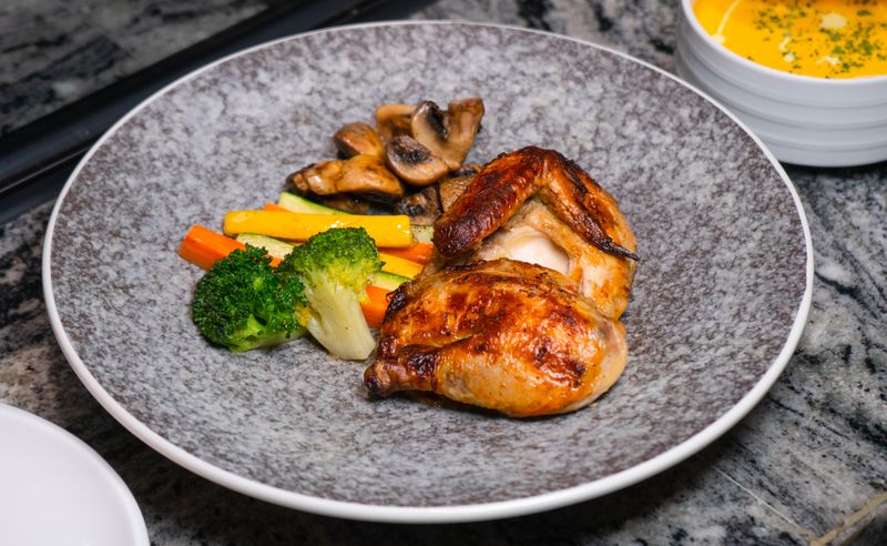 Coal roasted half chicken with herbs